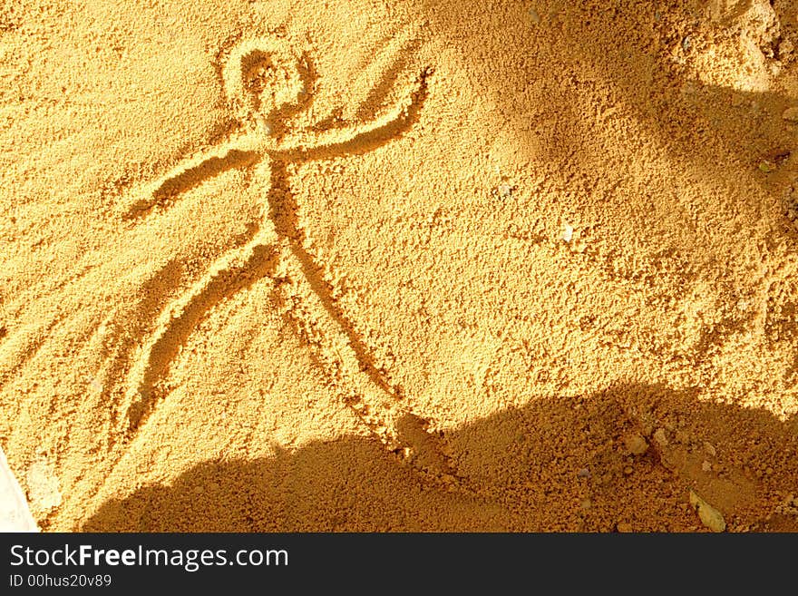 Sand guy : drawing of a person in the sand. Sand guy : drawing of a person in the sand