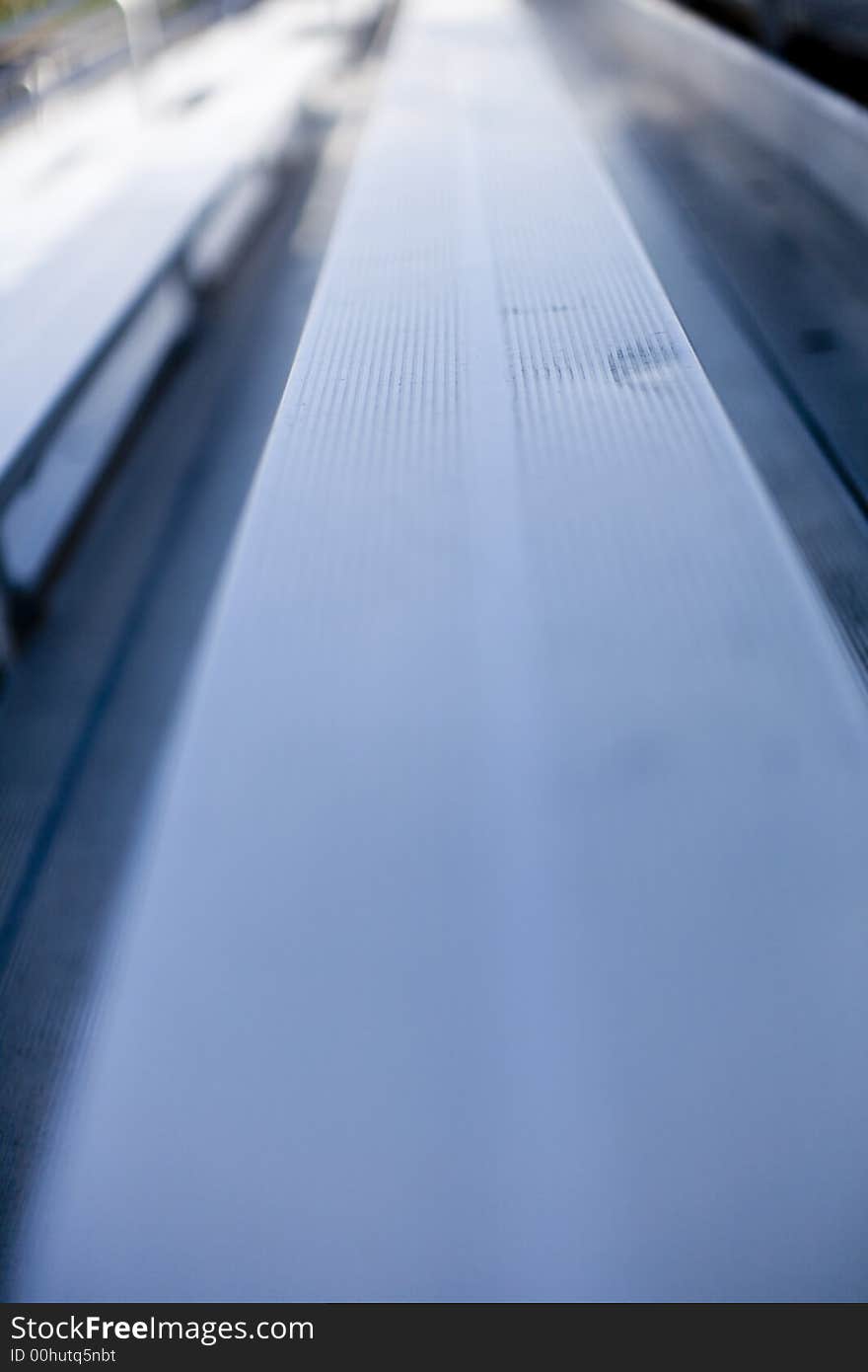 A stadium bench in a long perspective