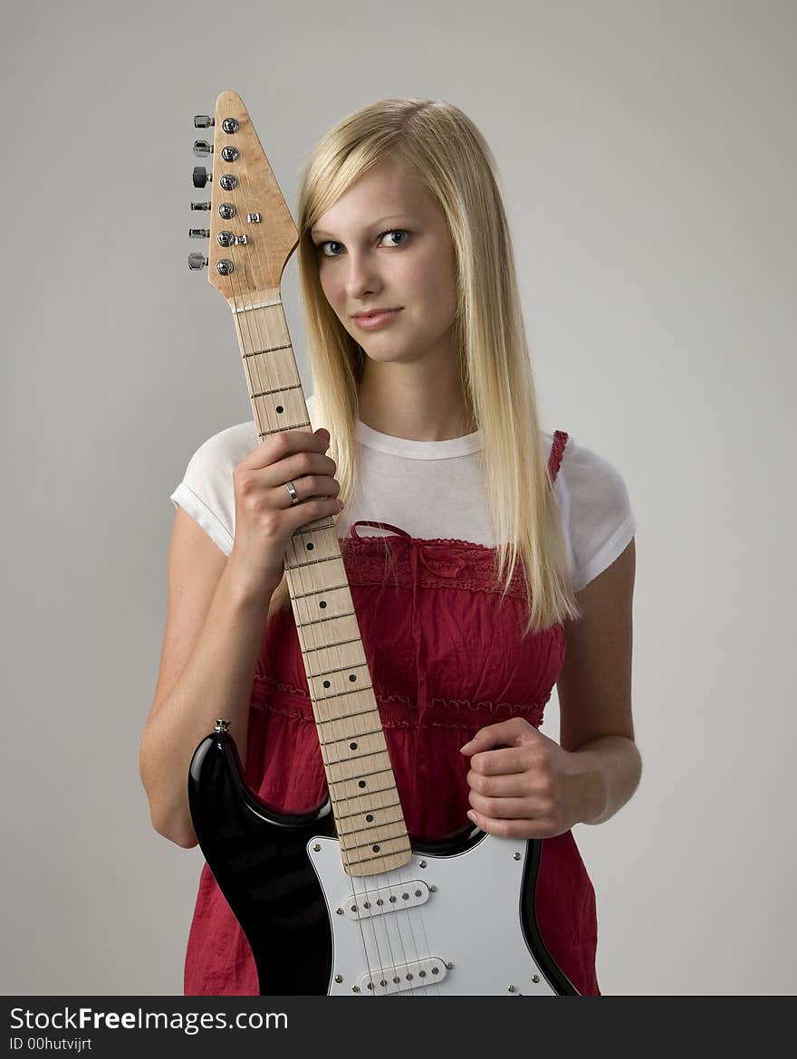 Teen girl with electric guitar