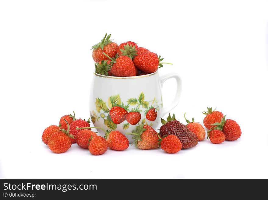 Strawberries in the pot on the white background