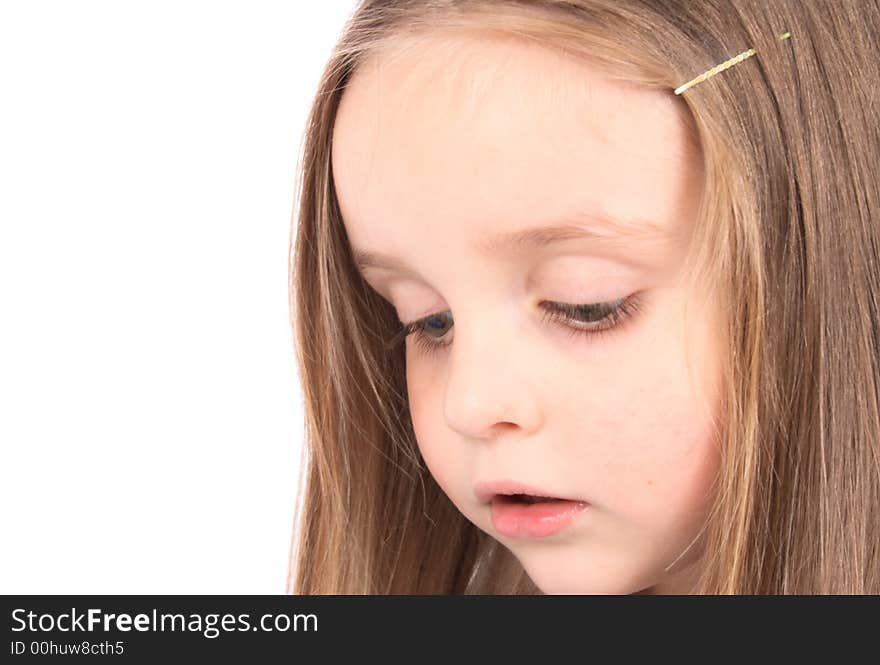 Detail of the face of the young girl on the white background