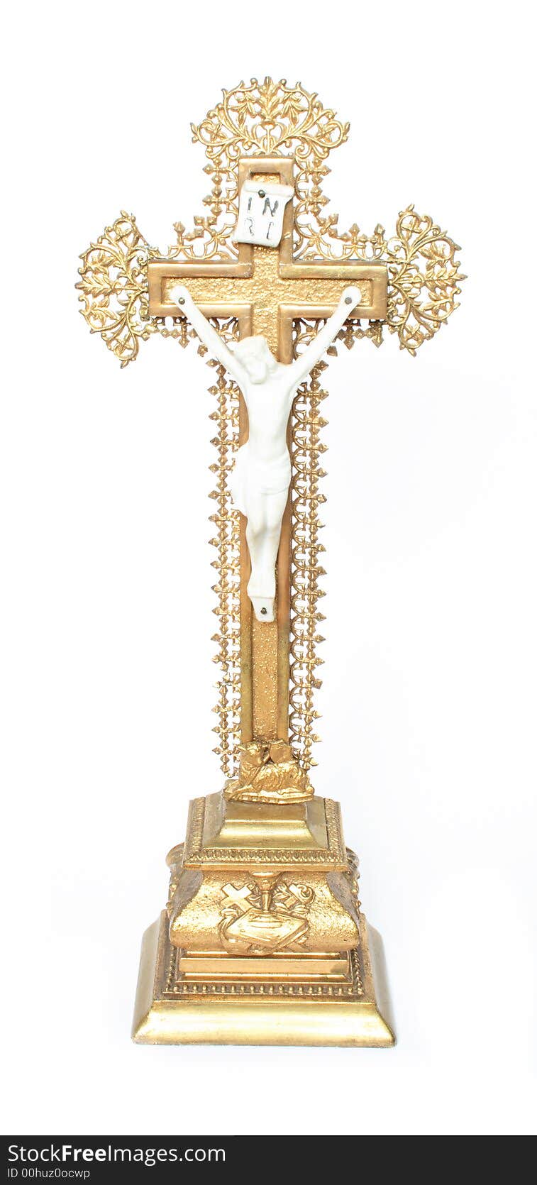 Golden crucifix on the white background