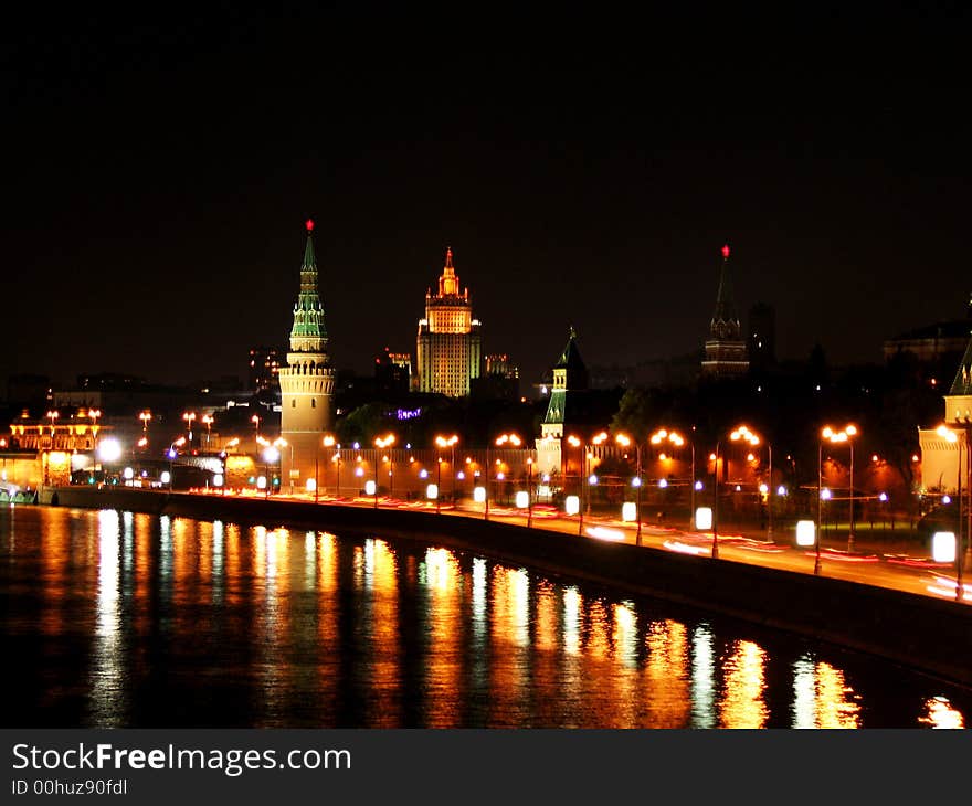 Riverside of the night Moscow with lightspots on the surface of water.