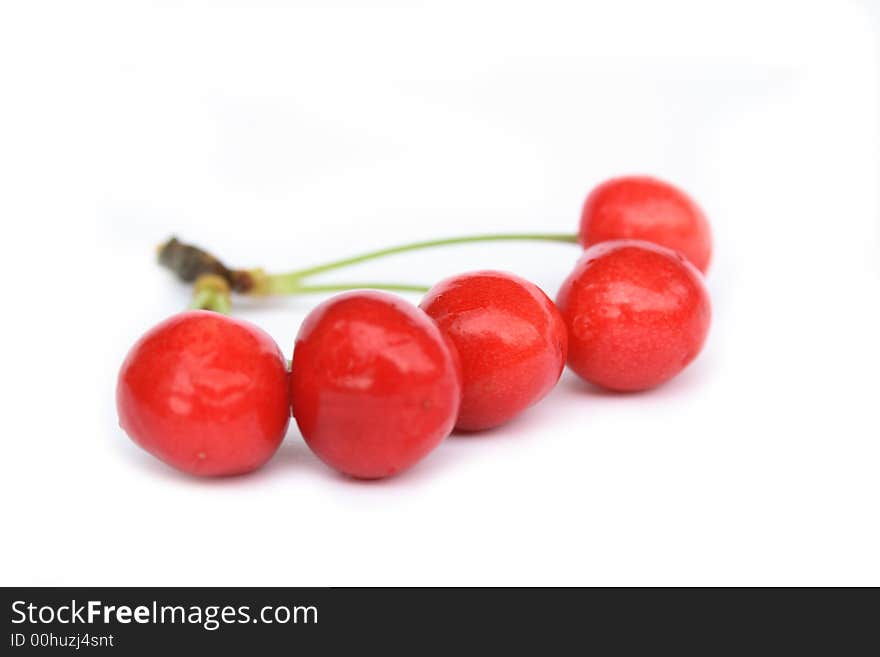 Fresh red cherries on the white background