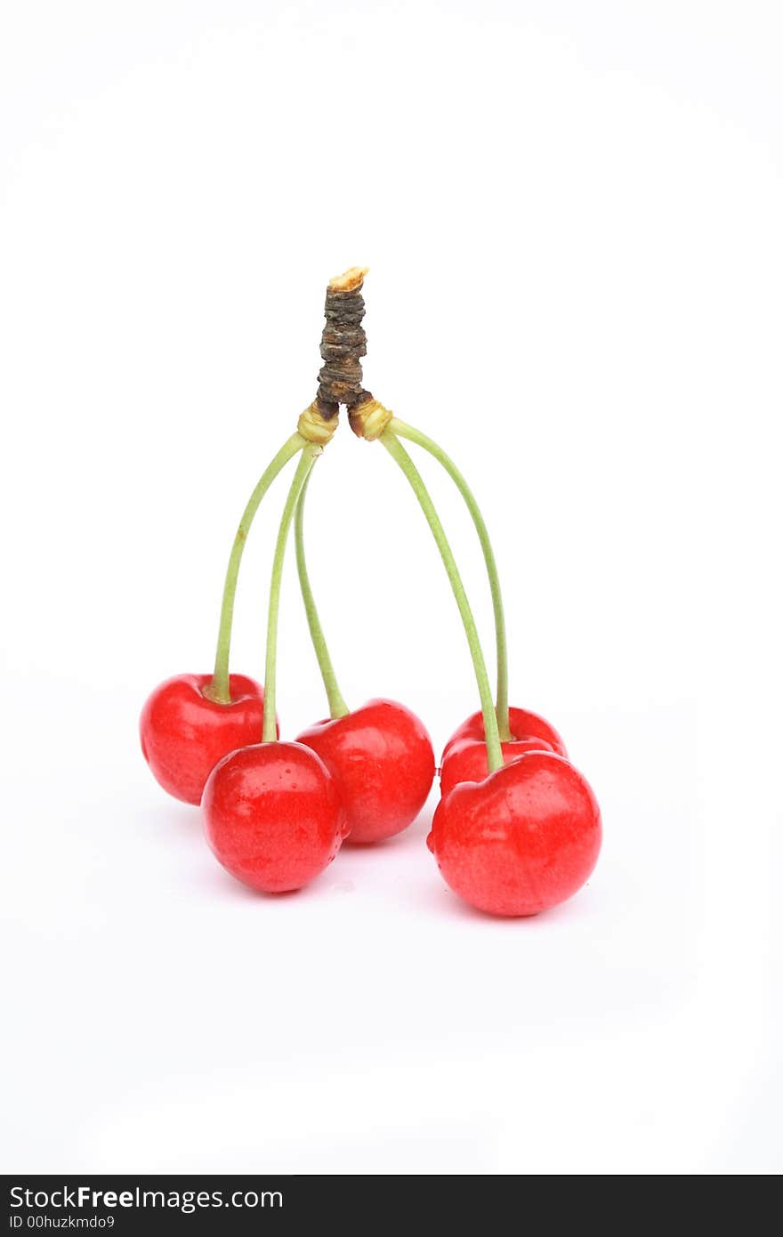 Fresh red cherries on the white background