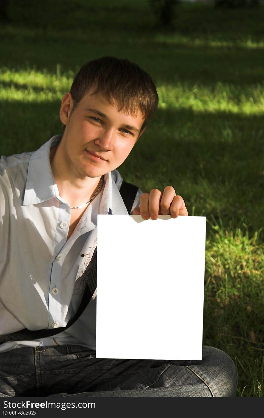 Teenage with leaf of a paper