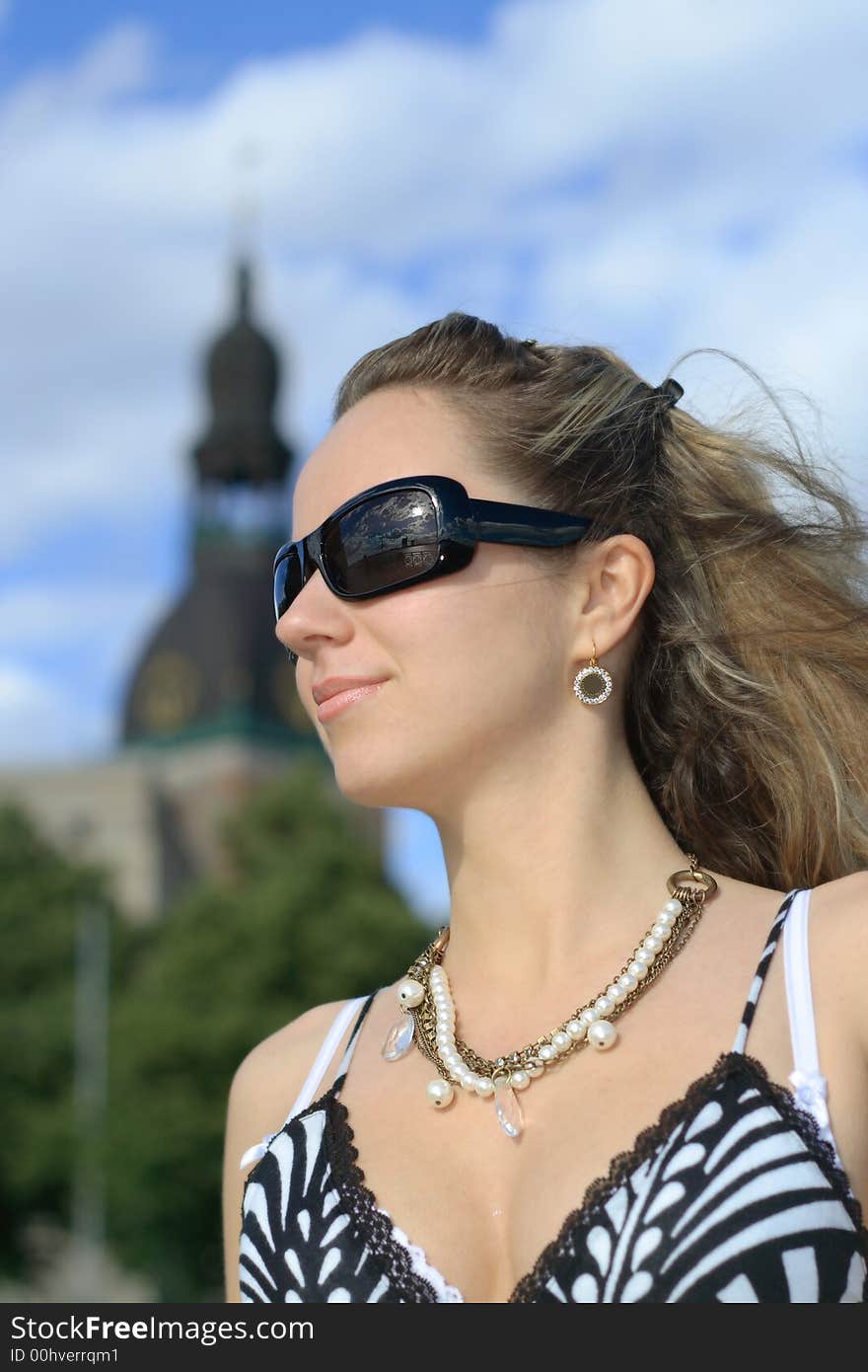 Beautiful young girl with sunglasses in the city. Beautiful young girl with sunglasses in the city