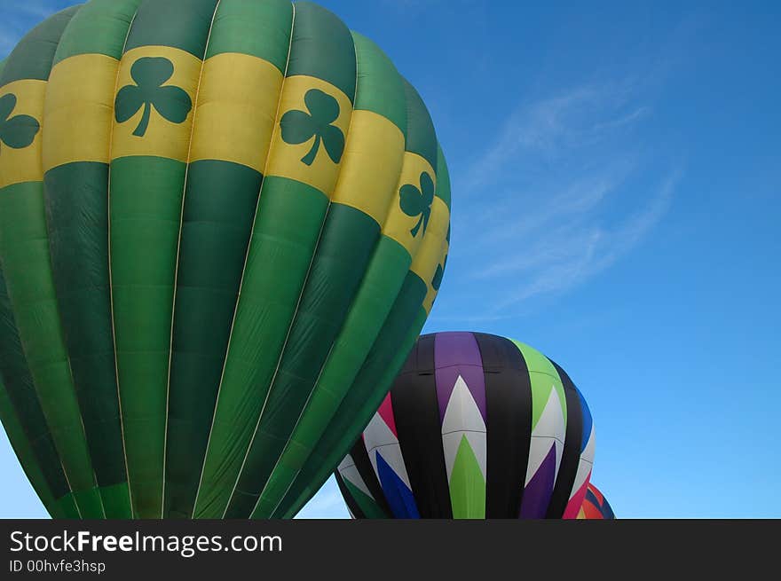 Closeup of colorful hot air balloons against  the blue summer sky