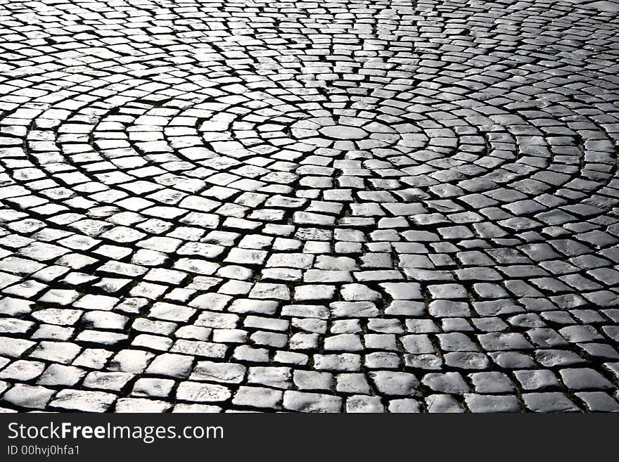 Cobblestone road in a view of the morning sun. Cobblestone road in a view of the morning sun