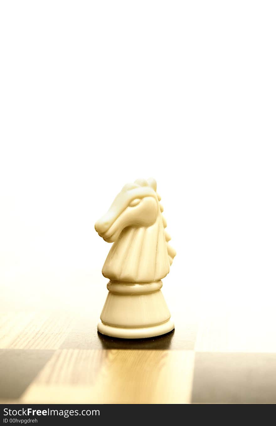 Picture of a knight figure on chessboard