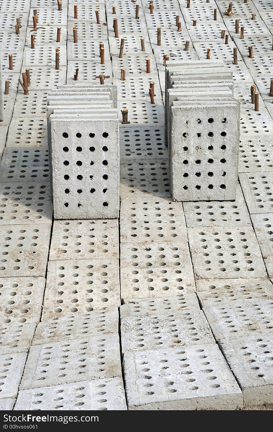 Concrete blocks and wooden nails. Concrete blocks and wooden nails