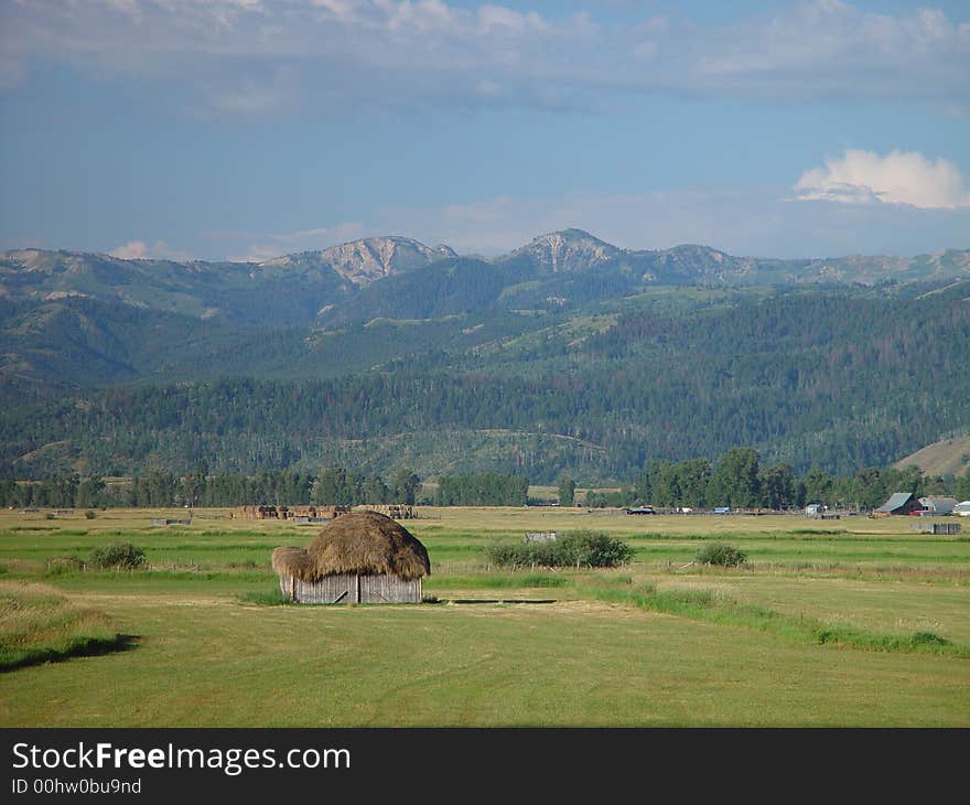 A small earthen hut in a mountain valley. A small earthen hut in a mountain valley.