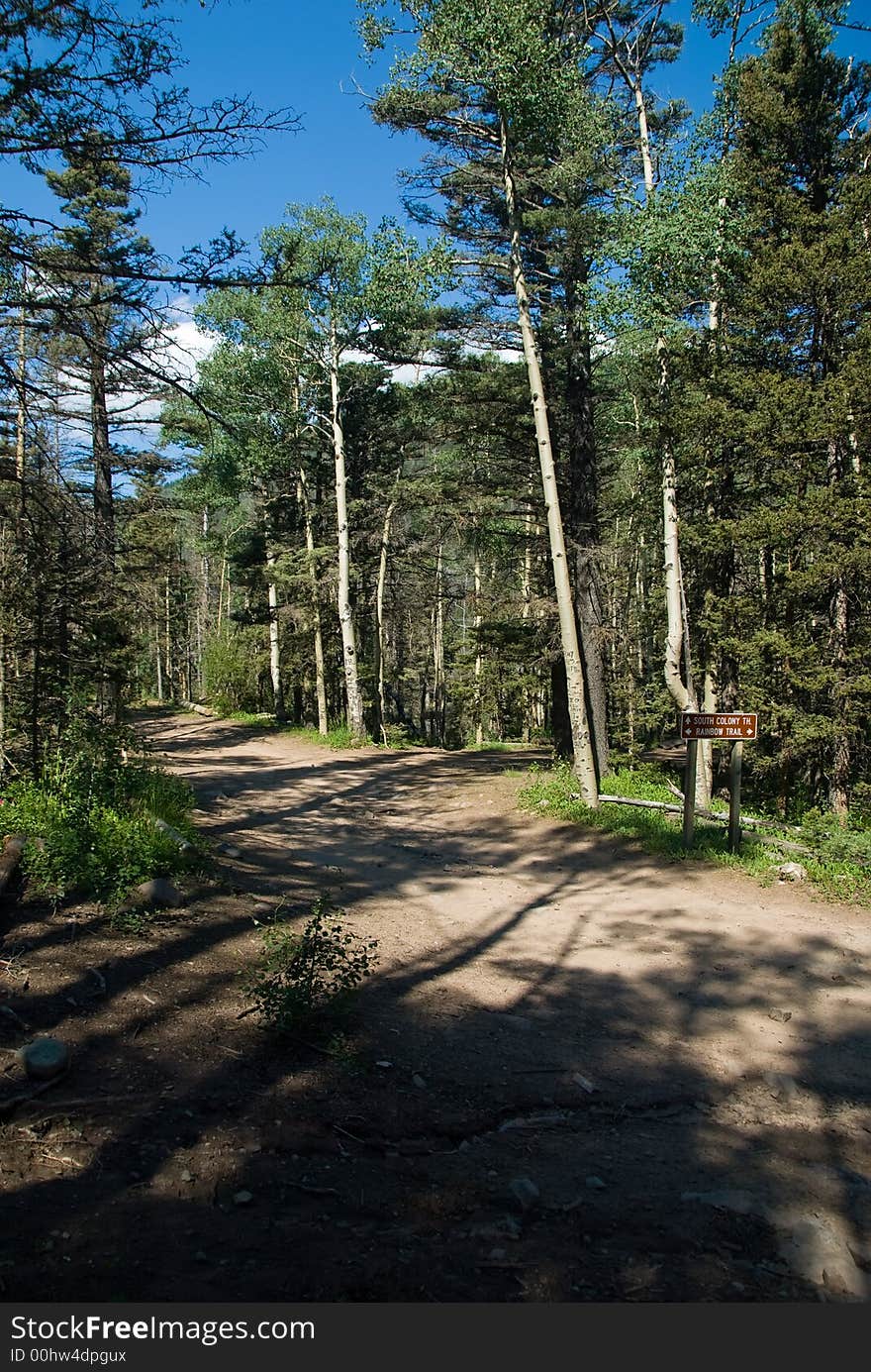 High mountain trail with sign