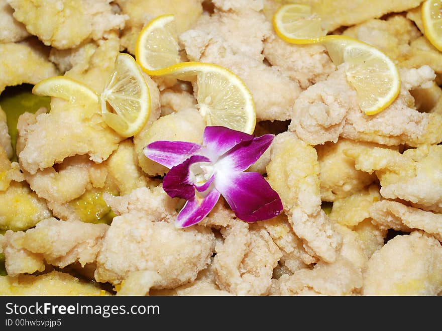 Lemon and fried chicken meat