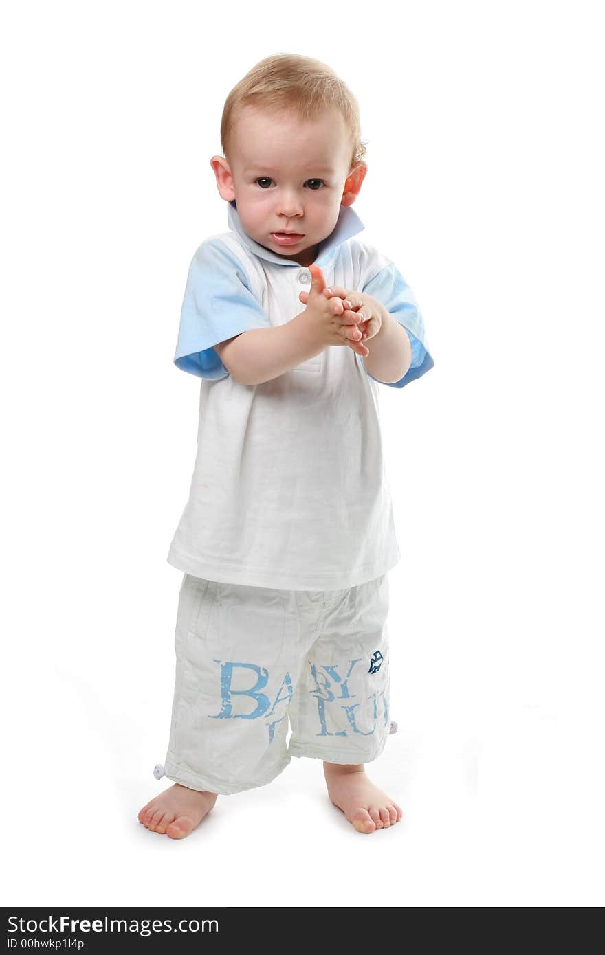 The child claps in a palm on a white background