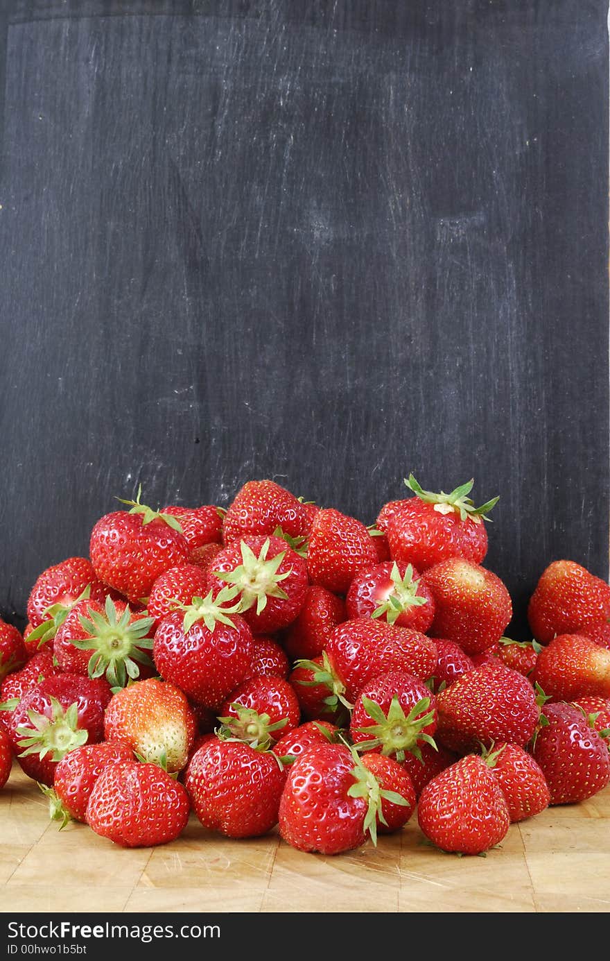 Some Strawberries on a board. Some Strawberries on a board