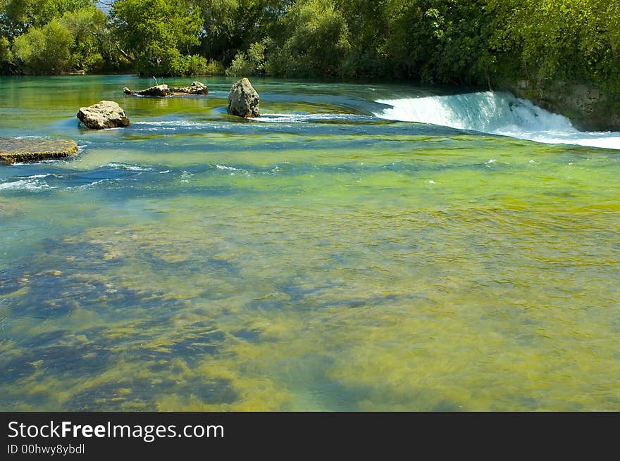 Green river and waterfall