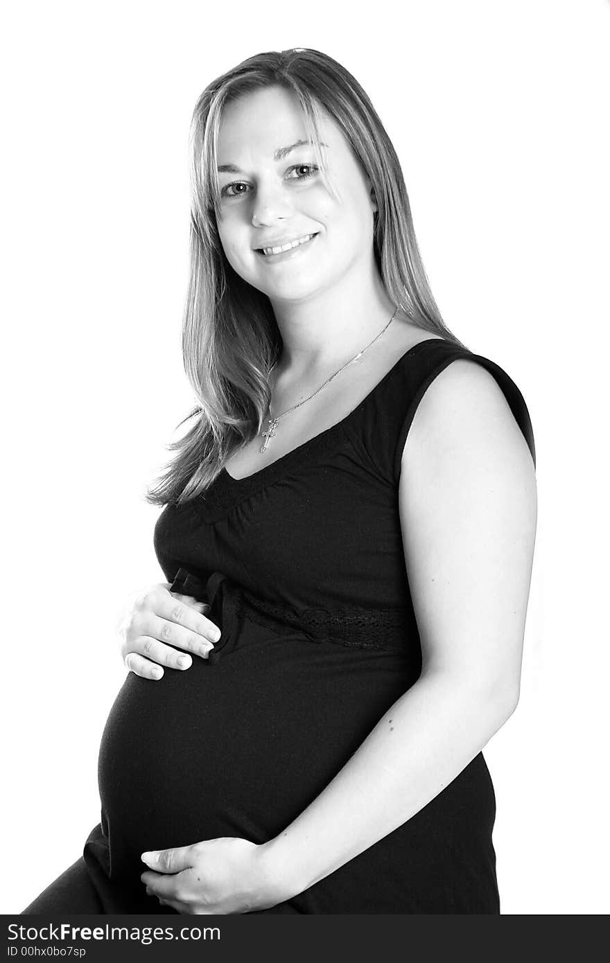 Black and white, portrait of a beautiful pregnant woman.