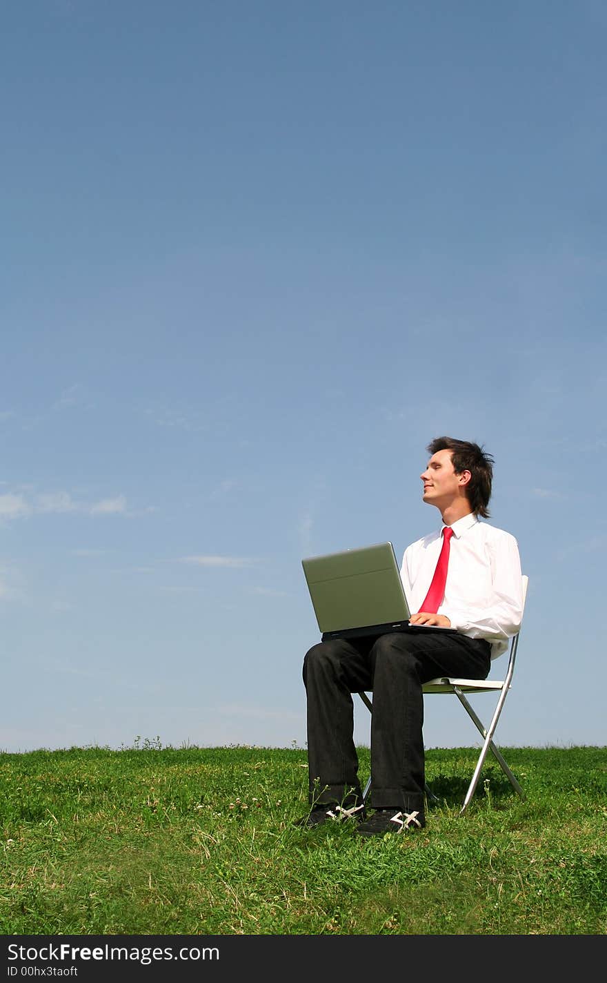 Man using laptop outdoors