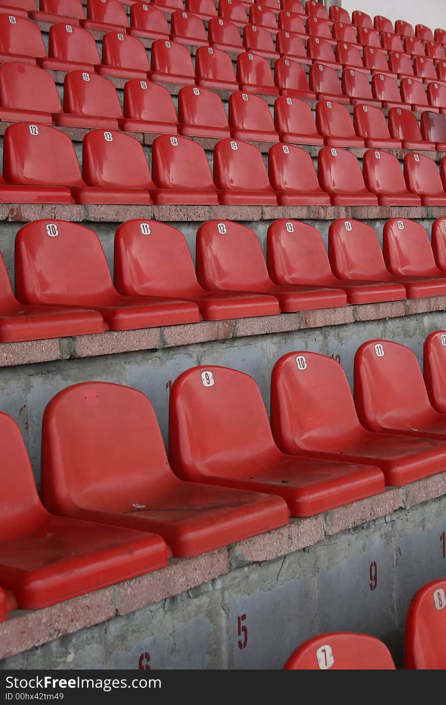 Stadium seats, in europe ,red chair, A field of empty stadium seats.