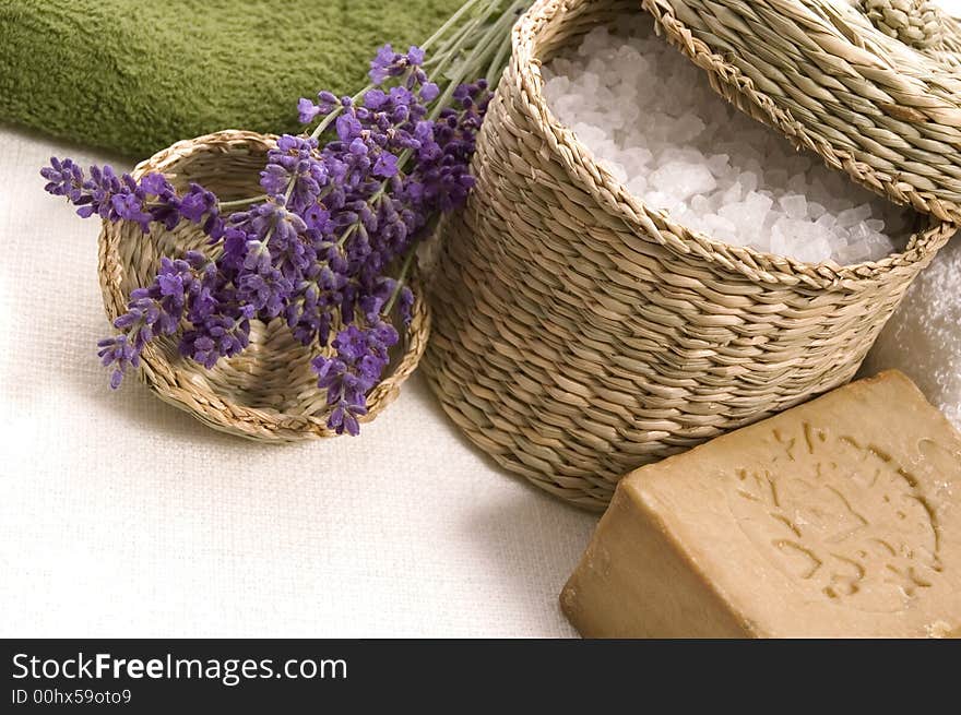 Lavender bath items. salt, towel, soap and fresh flower