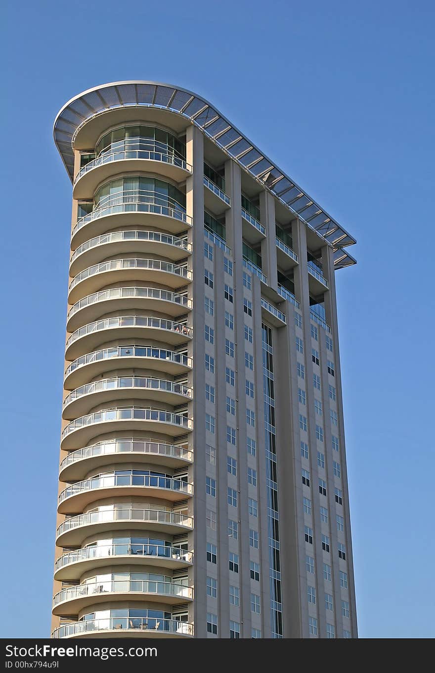 Modern condo tower with curved front. Modern condo tower with curved front