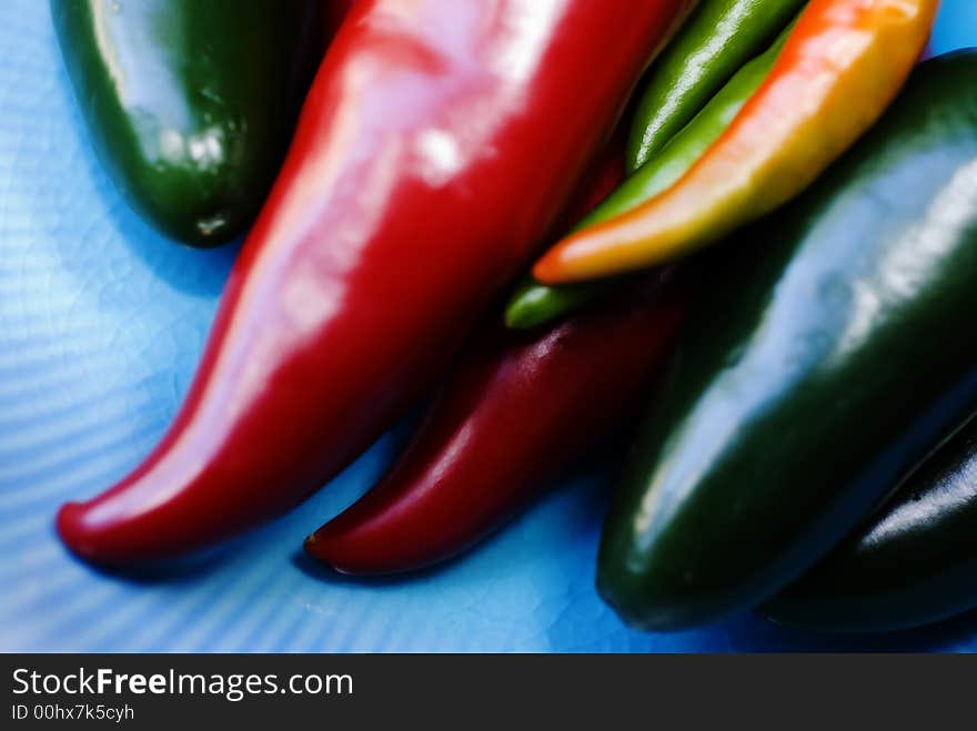 A variety of colorful and very hot peppers, ranging from Jalepenoes to Thai Firecarcker Peppers. A variety of colorful and very hot peppers, ranging from Jalepenoes to Thai Firecarcker Peppers.