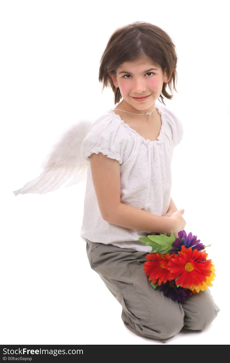 Angel girl with feather wings and flowers kneeling on white background. Angel girl with feather wings and flowers kneeling on white background