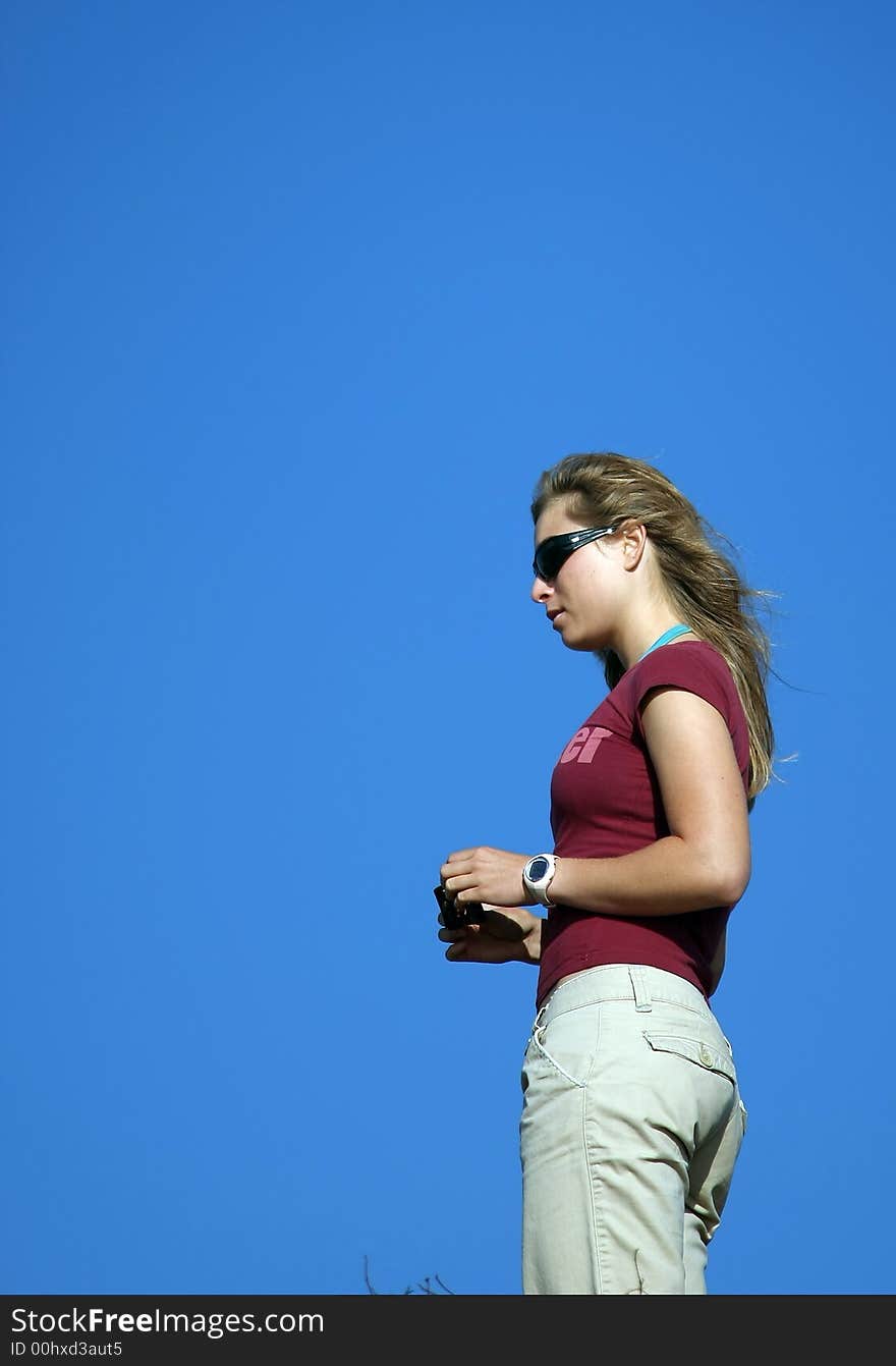 Young woman and a blue sky. Young woman and a blue sky