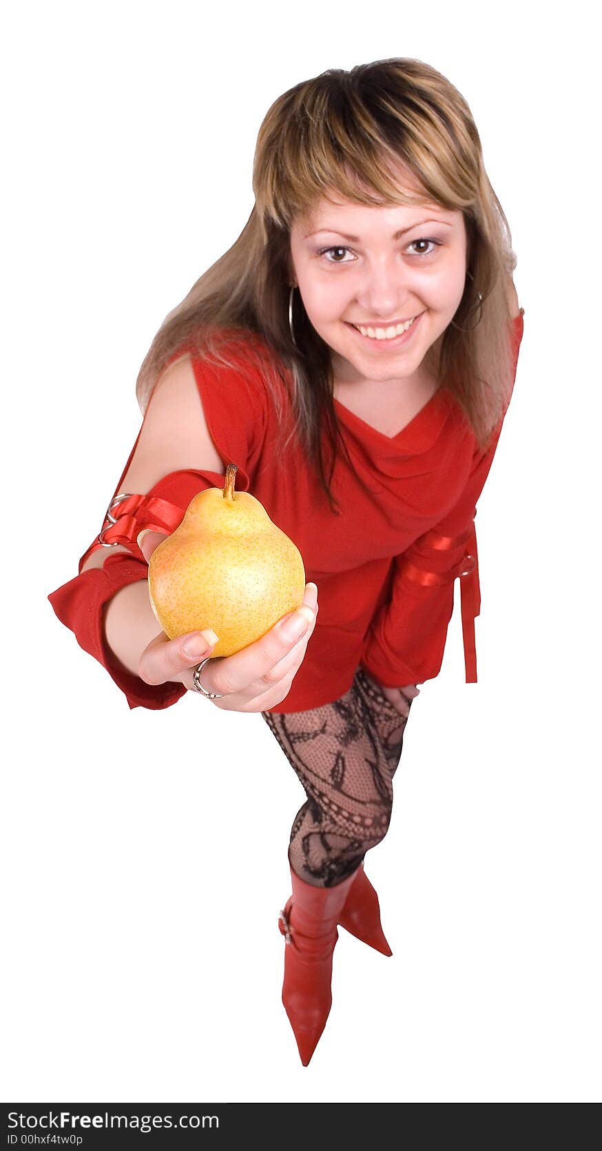 The girl offers a pear on white background. The girl offers a pear on white background