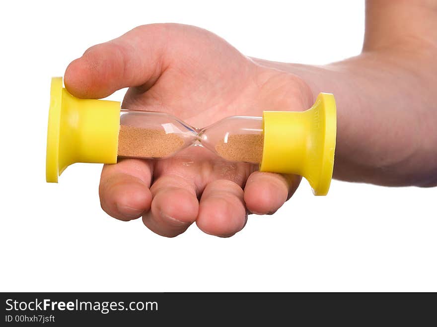 Sand-glass in a hand on white background