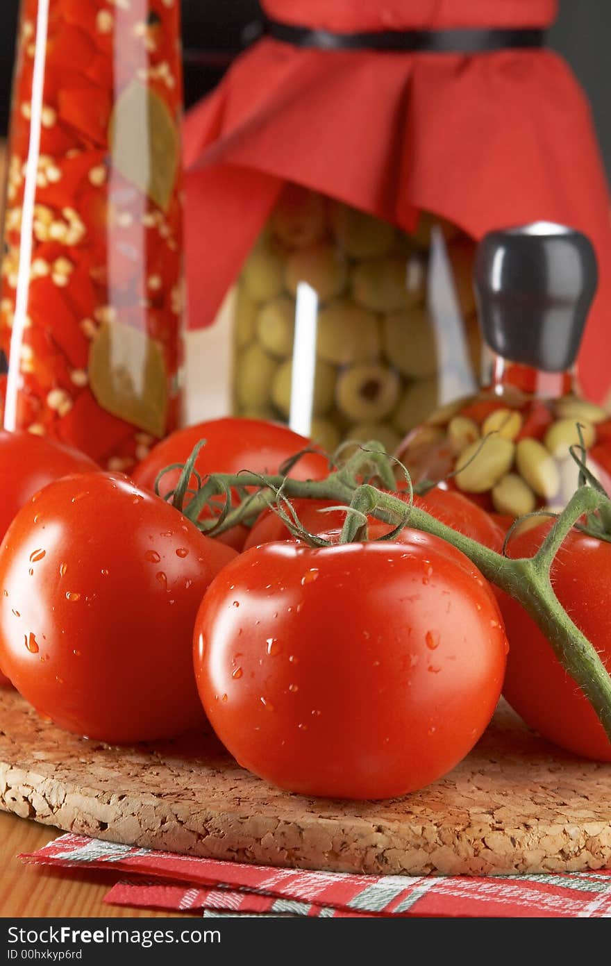 Still life with tomatoes and bootles