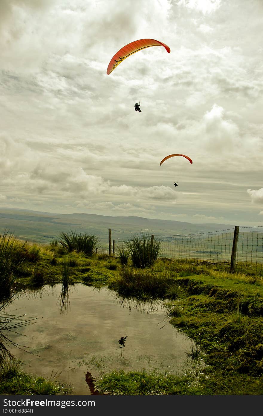 A view from the top of Whernside across the  valley to Ingleborough whilst a paragliding competition existed in the Yorkshire Dales, England. A view from the top of Whernside across the  valley to Ingleborough whilst a paragliding competition existed in the Yorkshire Dales, England.