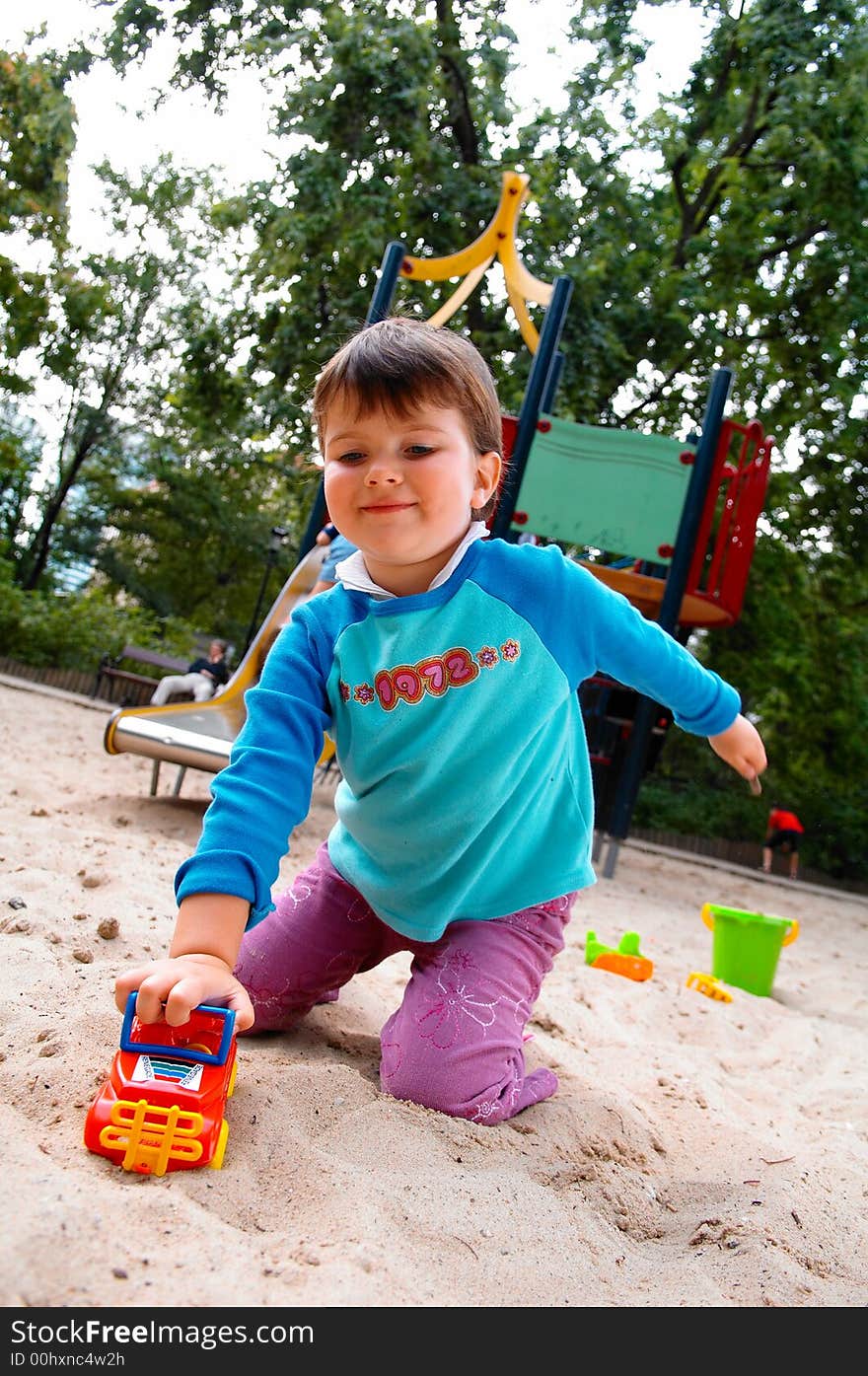 Portrait of little girl on playground