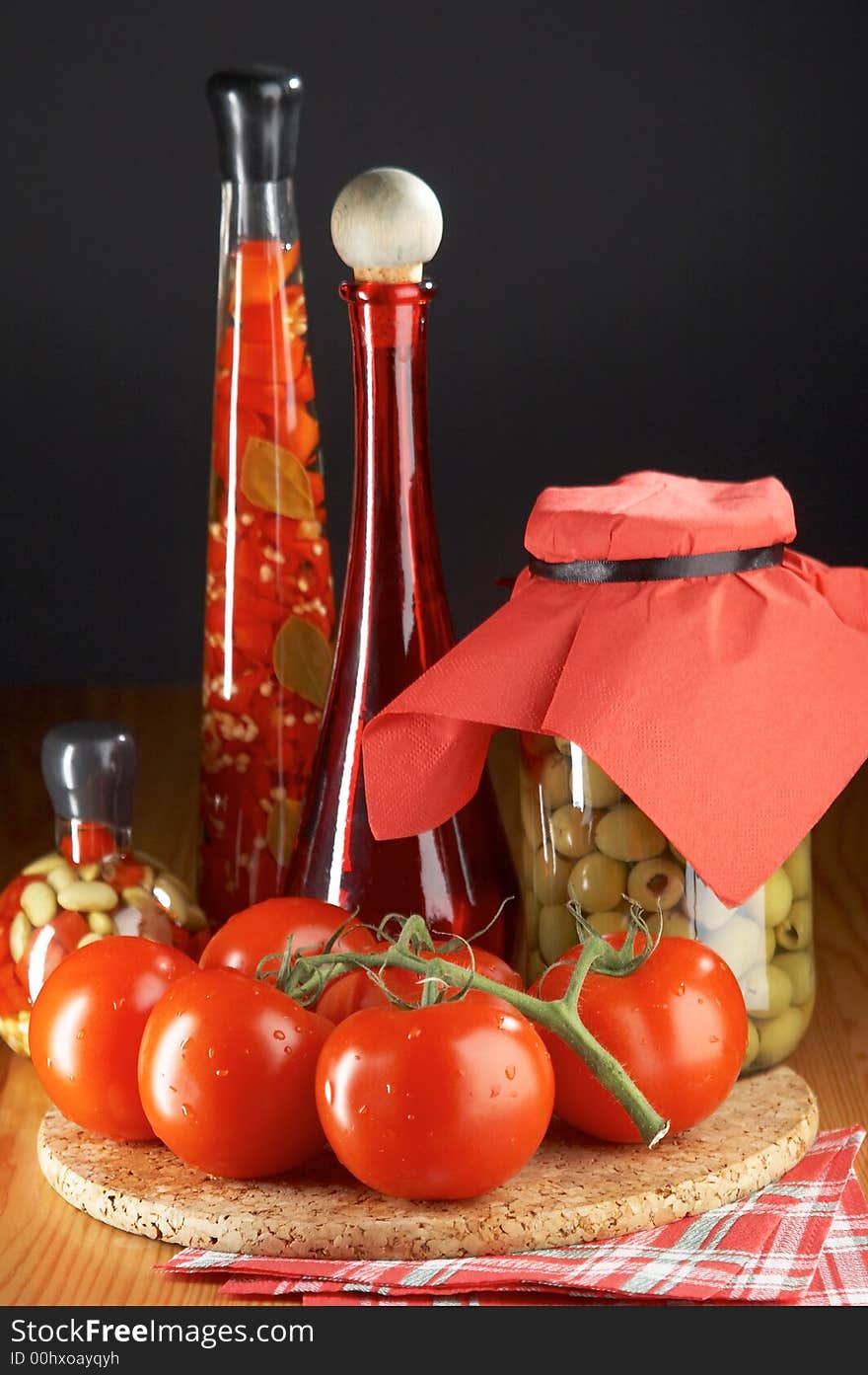 Still life with tomatoes and bootles