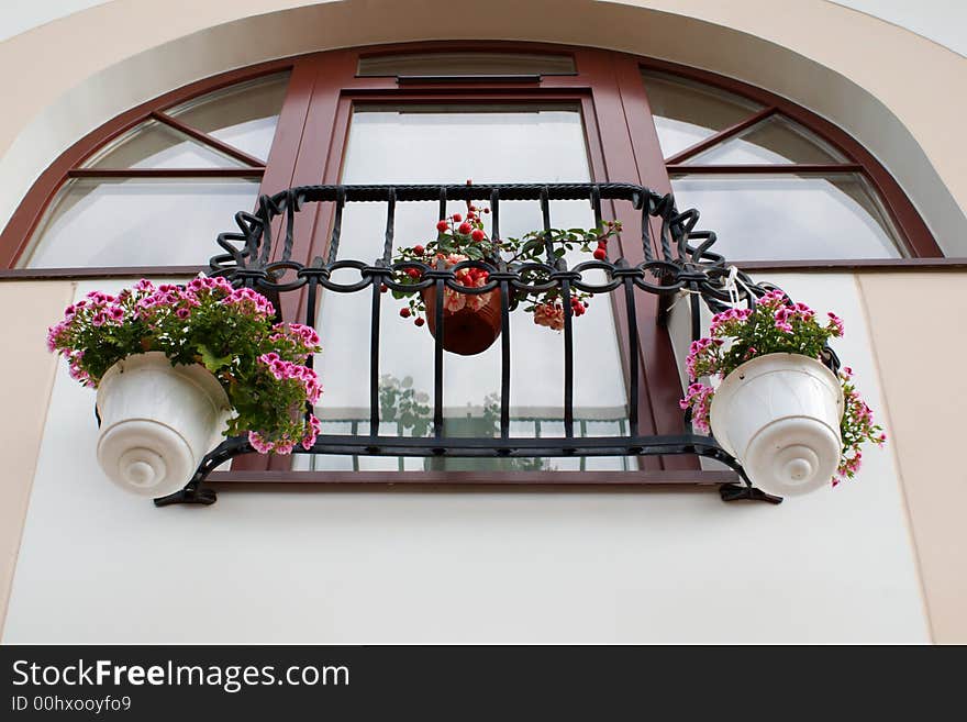 French balcony with hanging flower pots