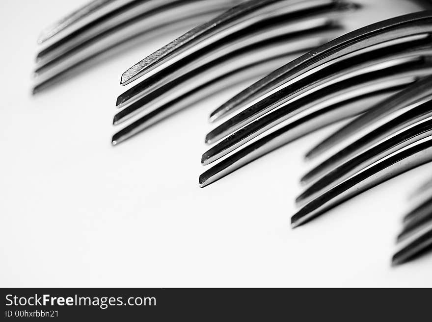 Still life of forks lined up