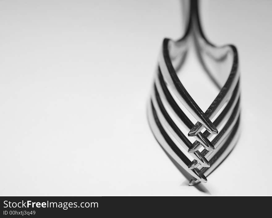 Black and white study of forks and the patterns they produce