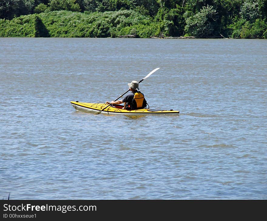 Kayaking the river in summer