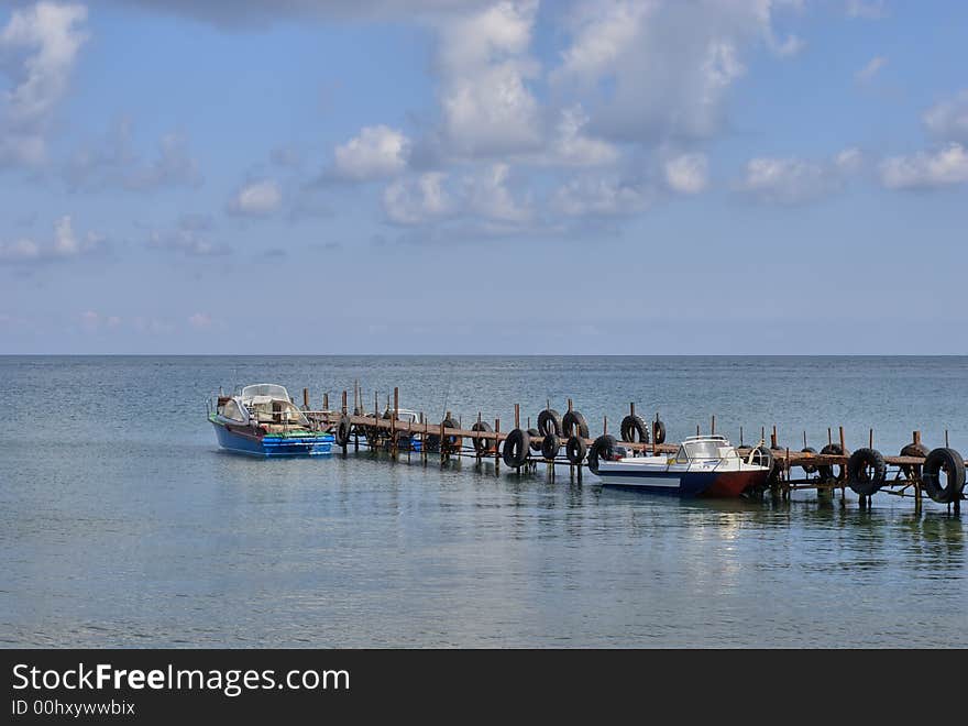 Sea quay with two boats (Ukraine, Crimea)