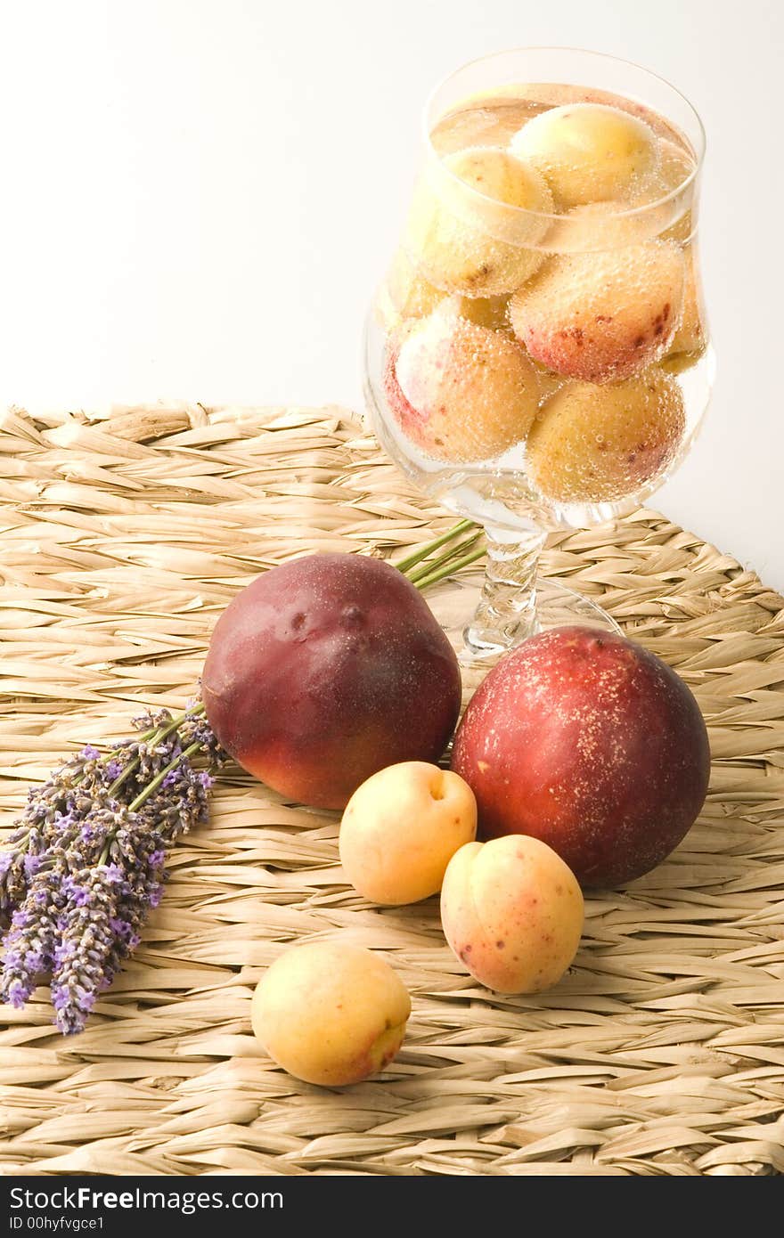 Peaches and apricots on the table with lavender. Peaches and apricots on the table with lavender