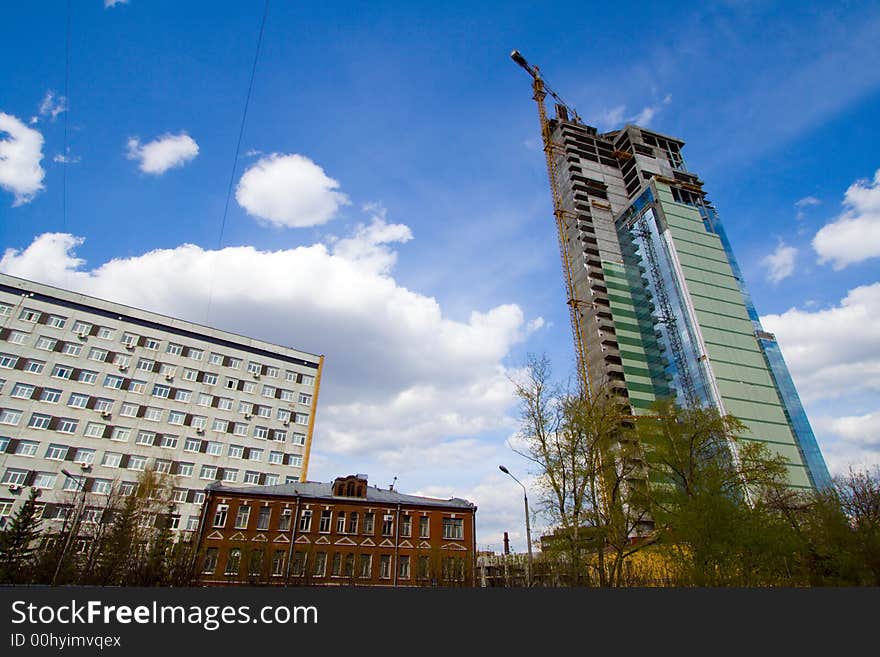 Blue sky at sunset in city and buildings under construction.