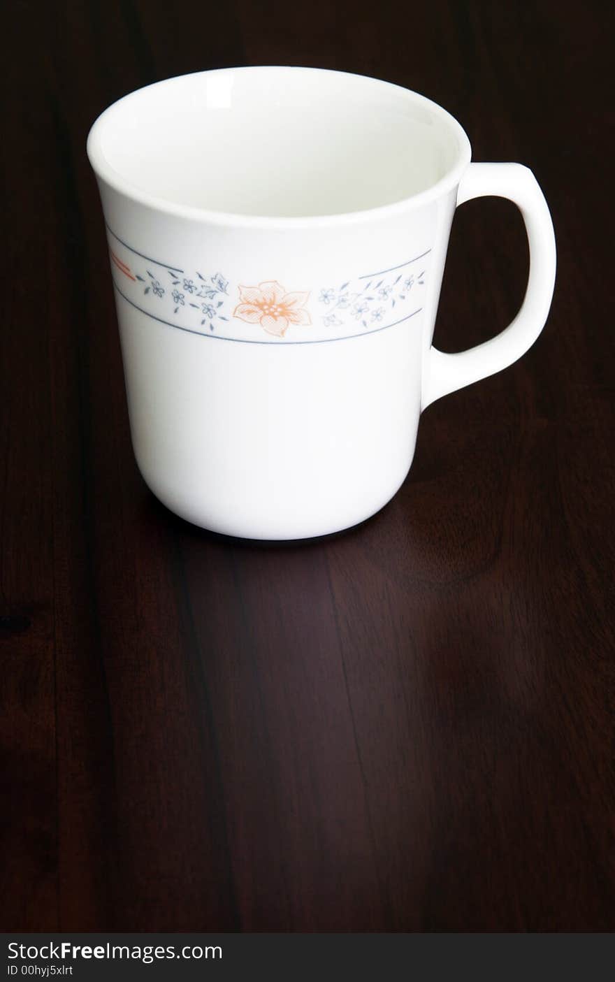 White Empty Coffee Cup On A Dark Wooden Table, Reflection. White Empty Coffee Cup On A Dark Wooden Table, Reflection