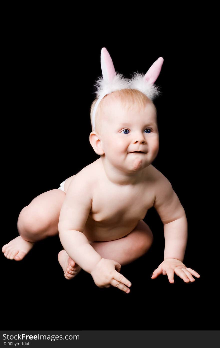 The small child in studio, on a black background. The small child in studio, on a black background