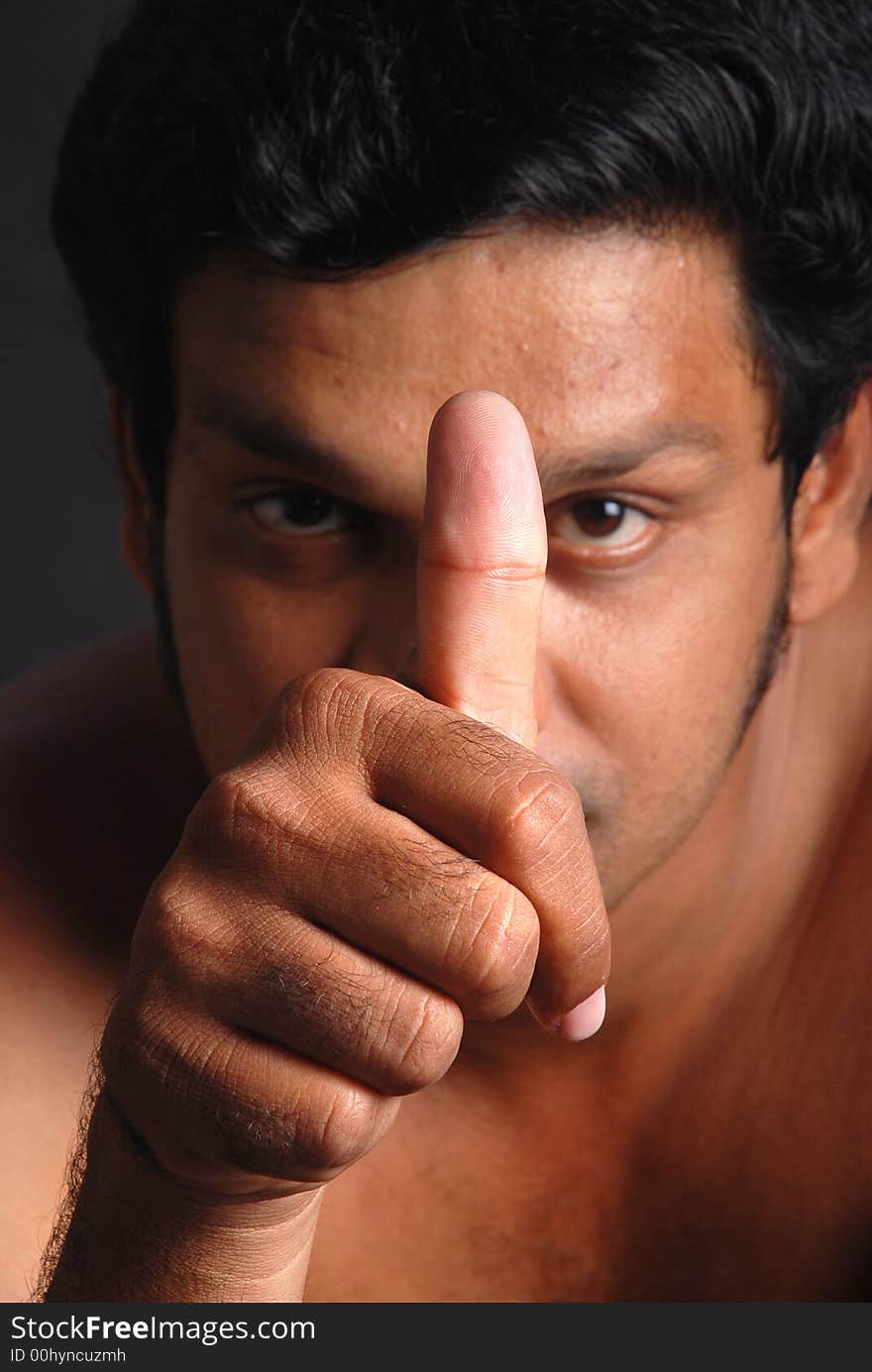 Portrait of casual man with thumbs up sign