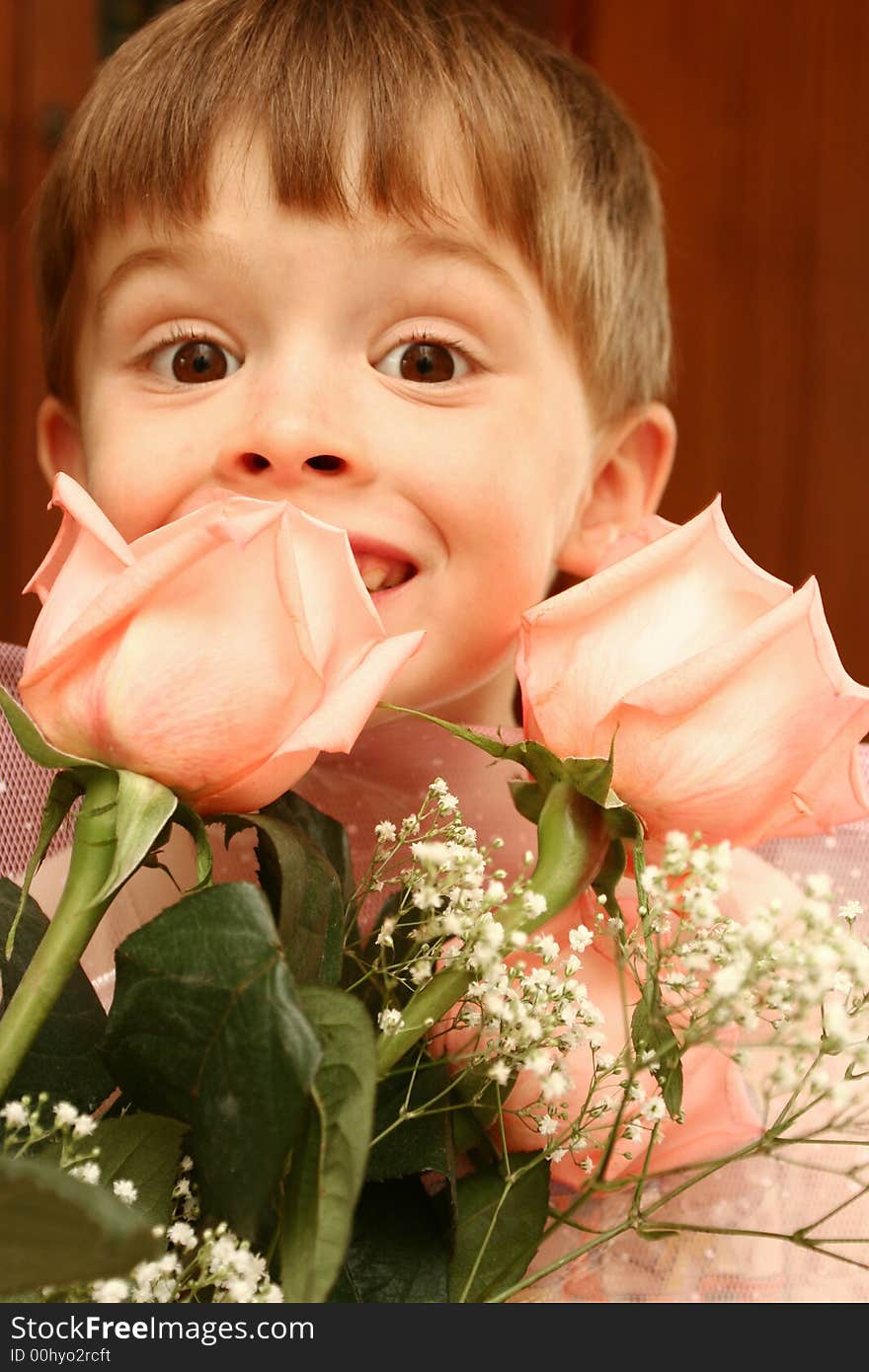 The nice boy and pink roses