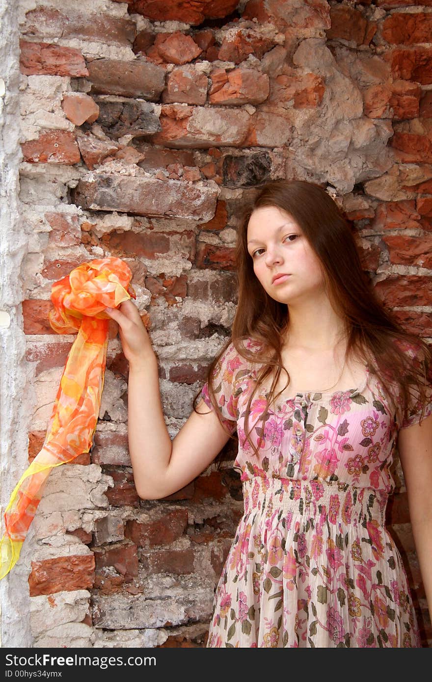 The young girl stend about old architectural ruins. It travels across the Europe and looks historical sights. It is interested in history of the Europe. At it a vacation, therefore it has decided to have a rest. The young girl stend about old architectural ruins. It travels across the Europe and looks historical sights. It is interested in history of the Europe. At it a vacation, therefore it has decided to have a rest.