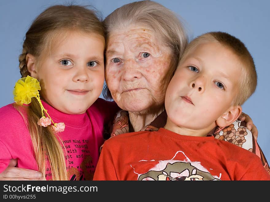 Happy grandsons sit with the grandmother. Happy grandsons sit with the grandmother