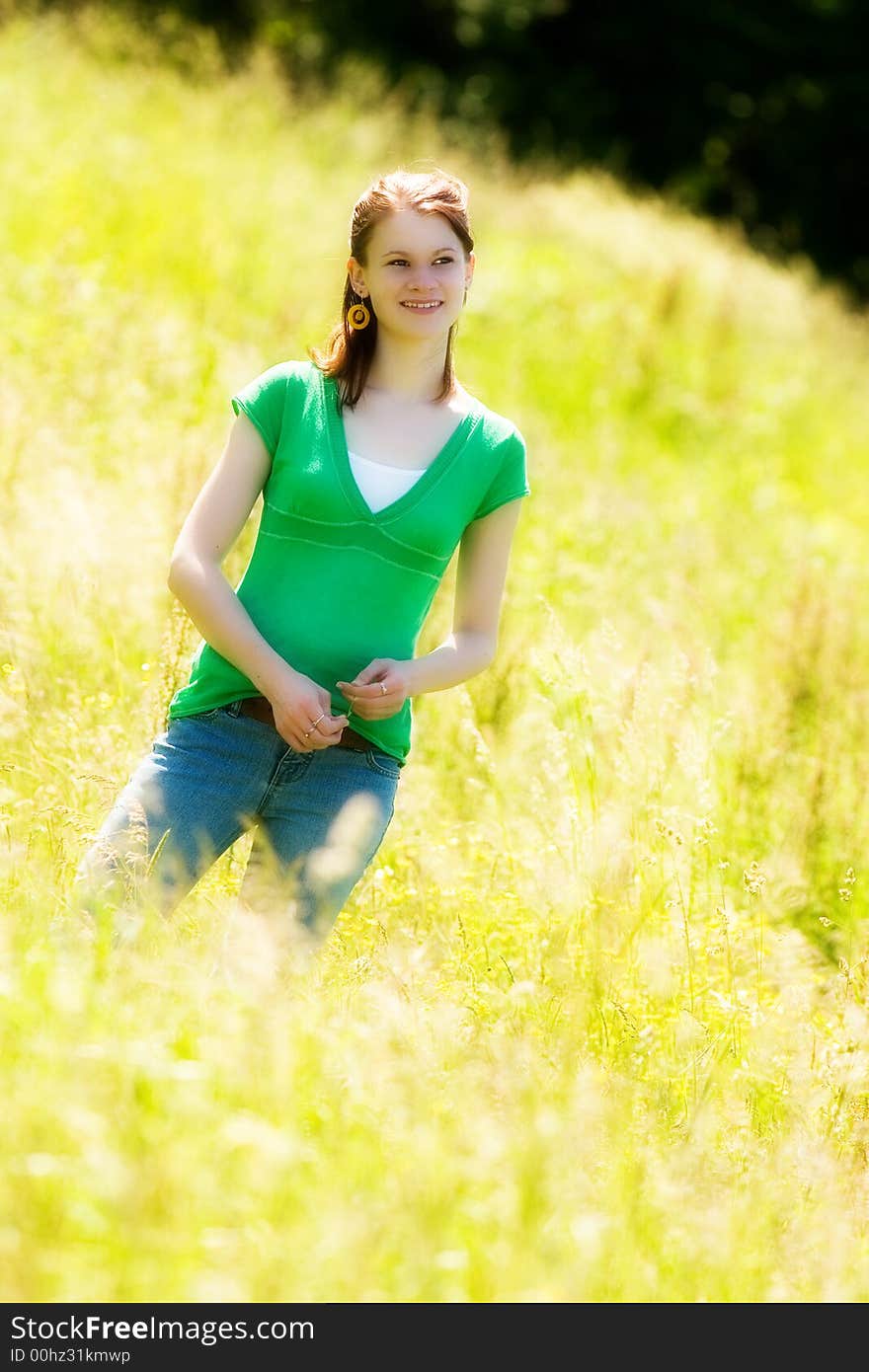 Portrait of a beautiful teen in a sun-drenched field. Portrait of a beautiful teen in a sun-drenched field.