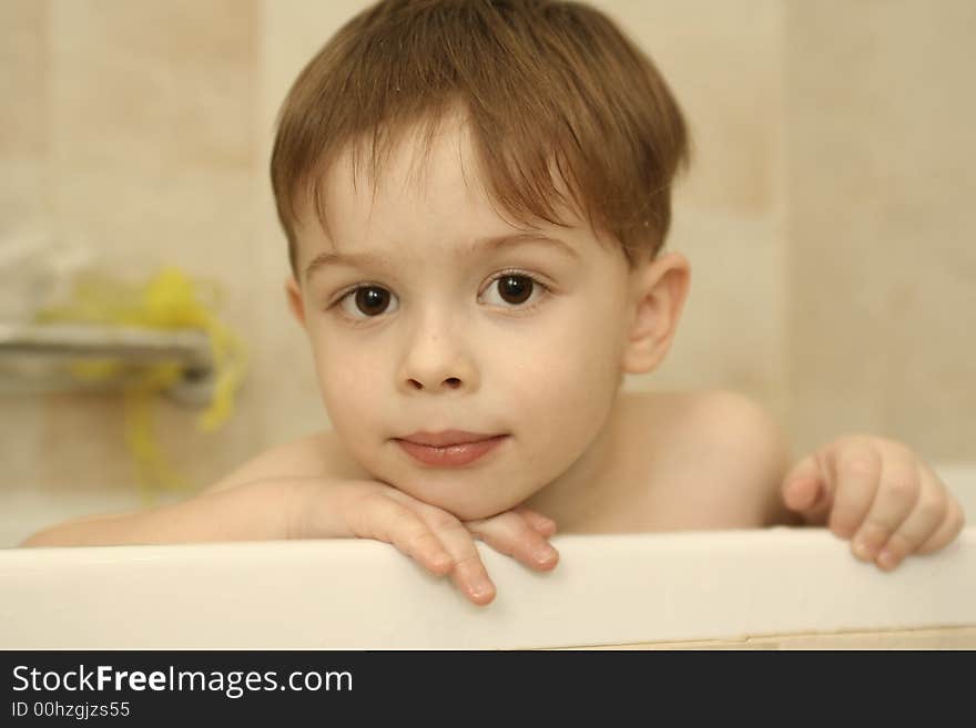 Sight of the boy which sits in bathing